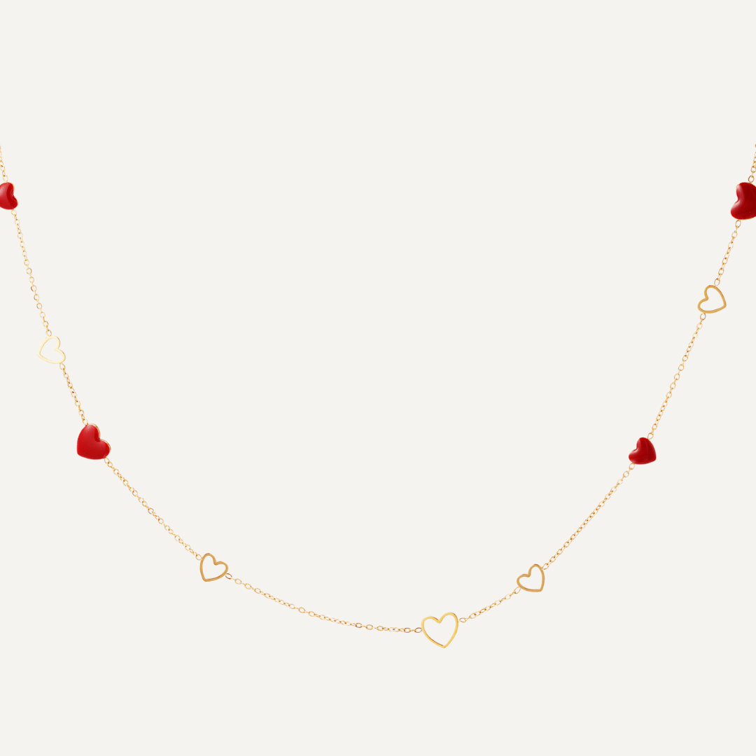 Collana Pandora con ciondoli a forma di cuore alternati rossi e vuoti, realizzata in acciaio inossidabile, anallergico e resiste, Finitura oro - Trinwel.com